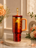 The Stanley 1913 x KAROL G 40 oz Quencher H2.O FlowState Tumbler